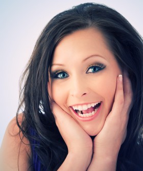 Headshot of excited young woman