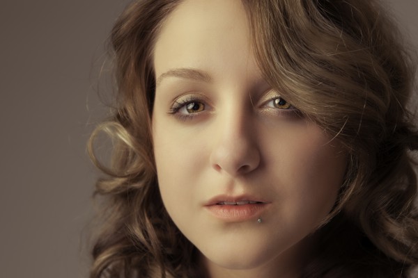 Attractive woman looks at camera